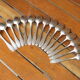 15 small silver metal spoons with rows of beads