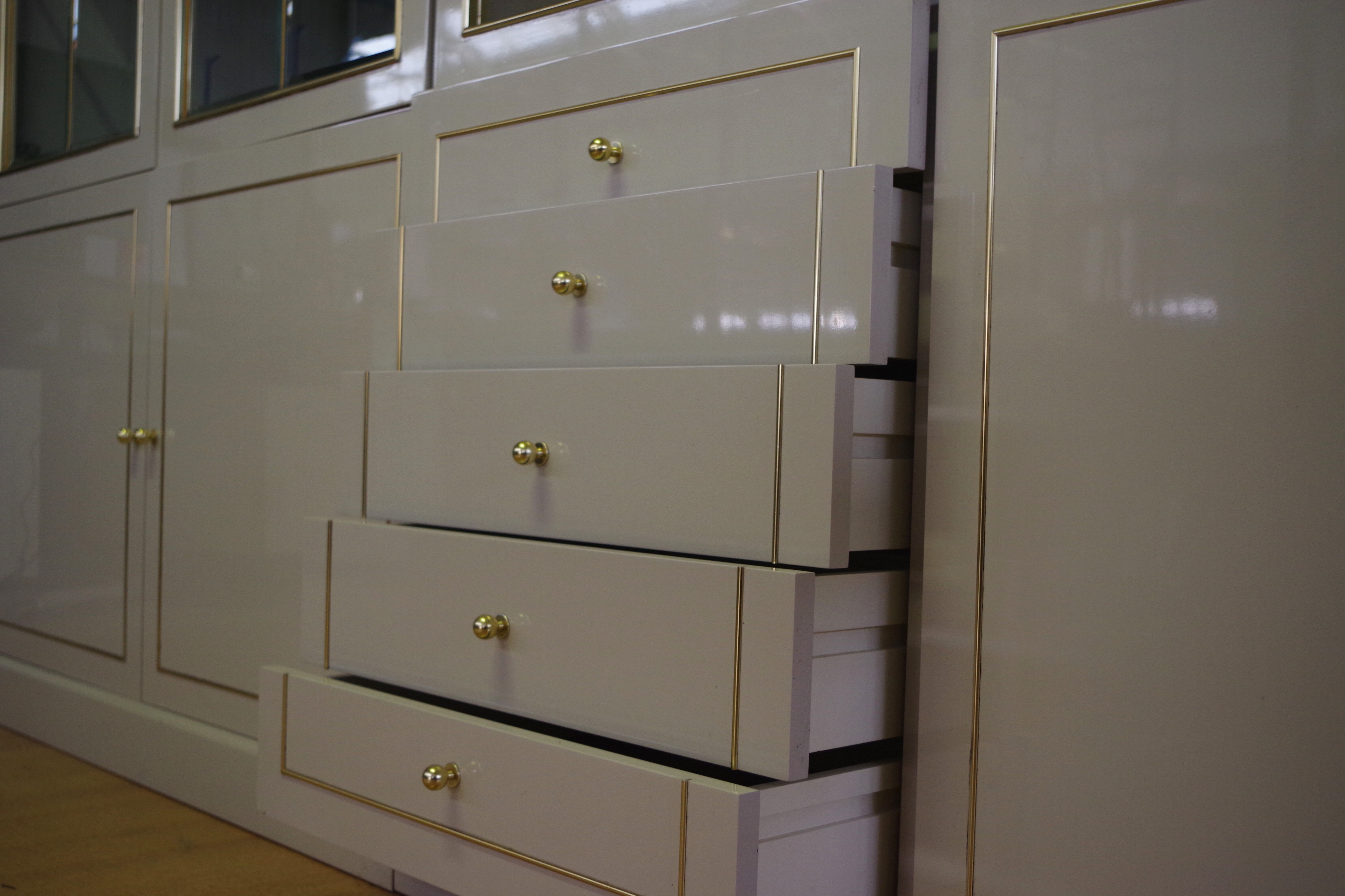 Showcases in lacquered wood, glass and brass  1970s, set of 4