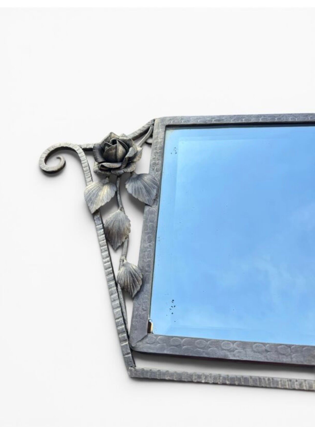 Art Deco mirror from the 1930s in silvered wrought iron, decorated with roses.