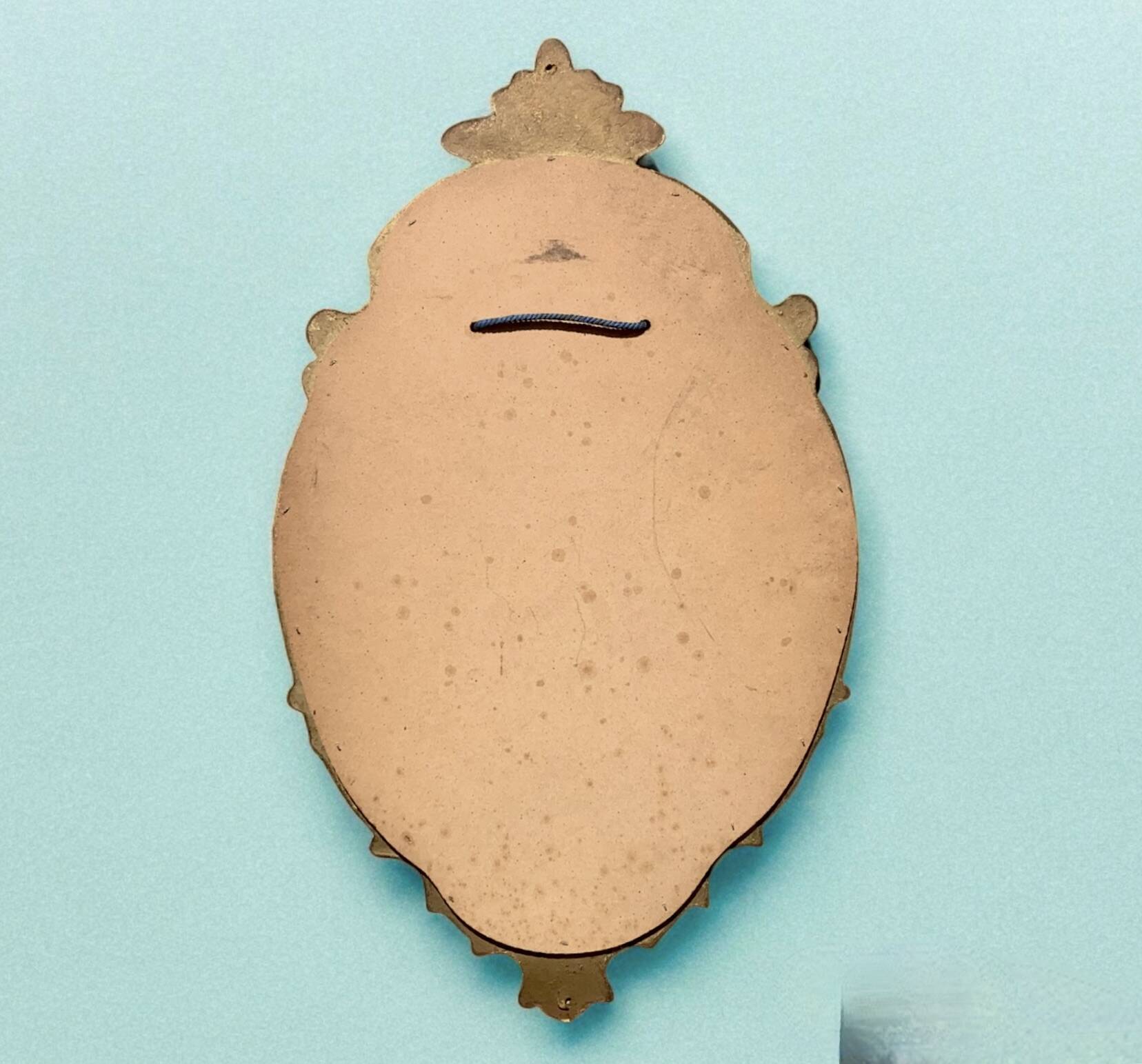 Vintage wall mirror in gold resin