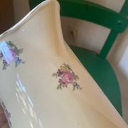 Old flowery and gilded pitcher.