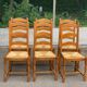 6 solid oak dining chairs with rush seats from the 1980s.