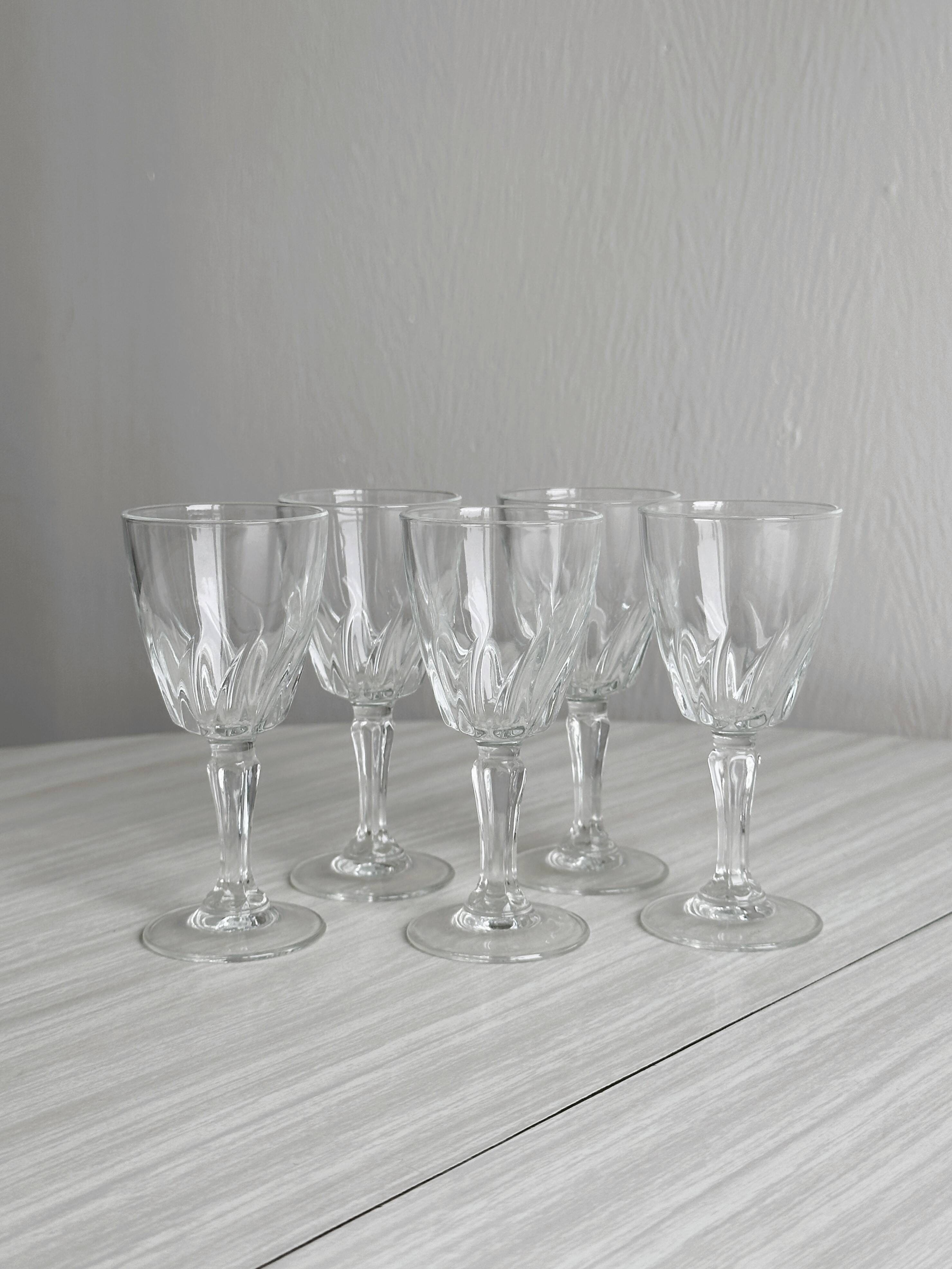 5 clear crystal liqueur glasses.