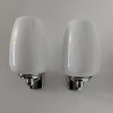 Chrome and opaline wall lights from the 70s.