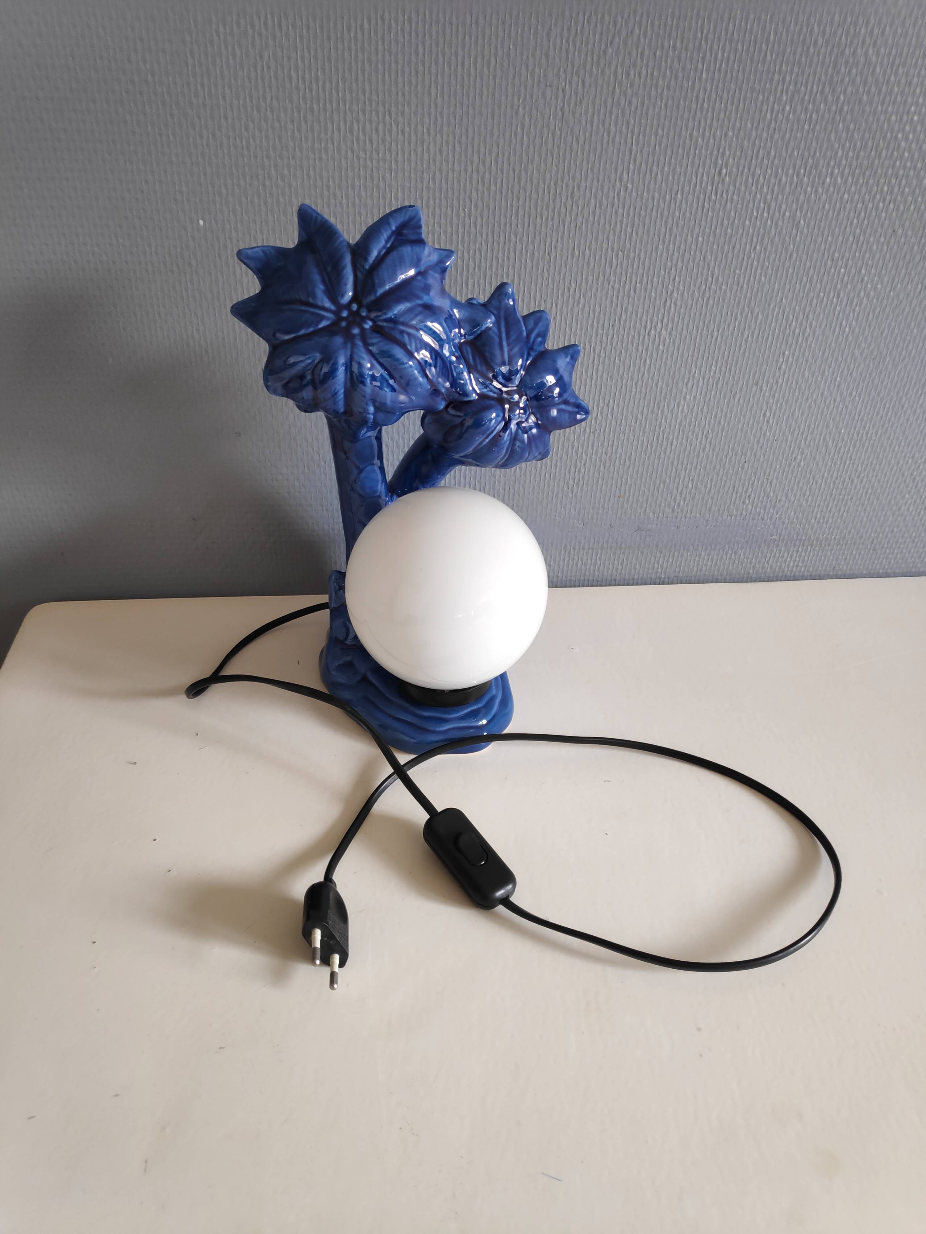Blue ceramic palm lamp and white opaline globe