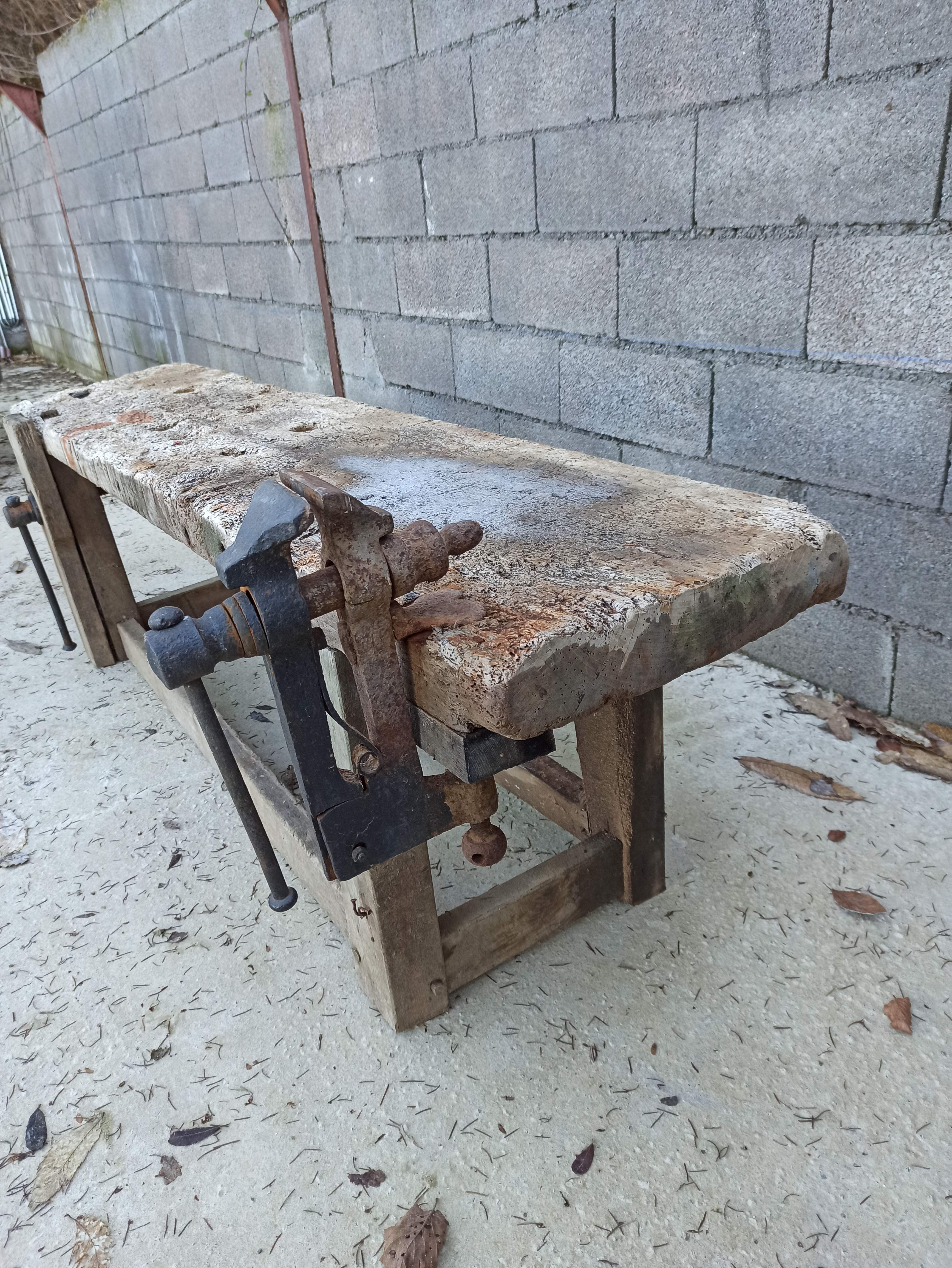 Wooden carpenter's workbench with iron and wooden vice
