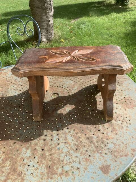 Bench in carved and varnished wood, mountain chalet decoration, old