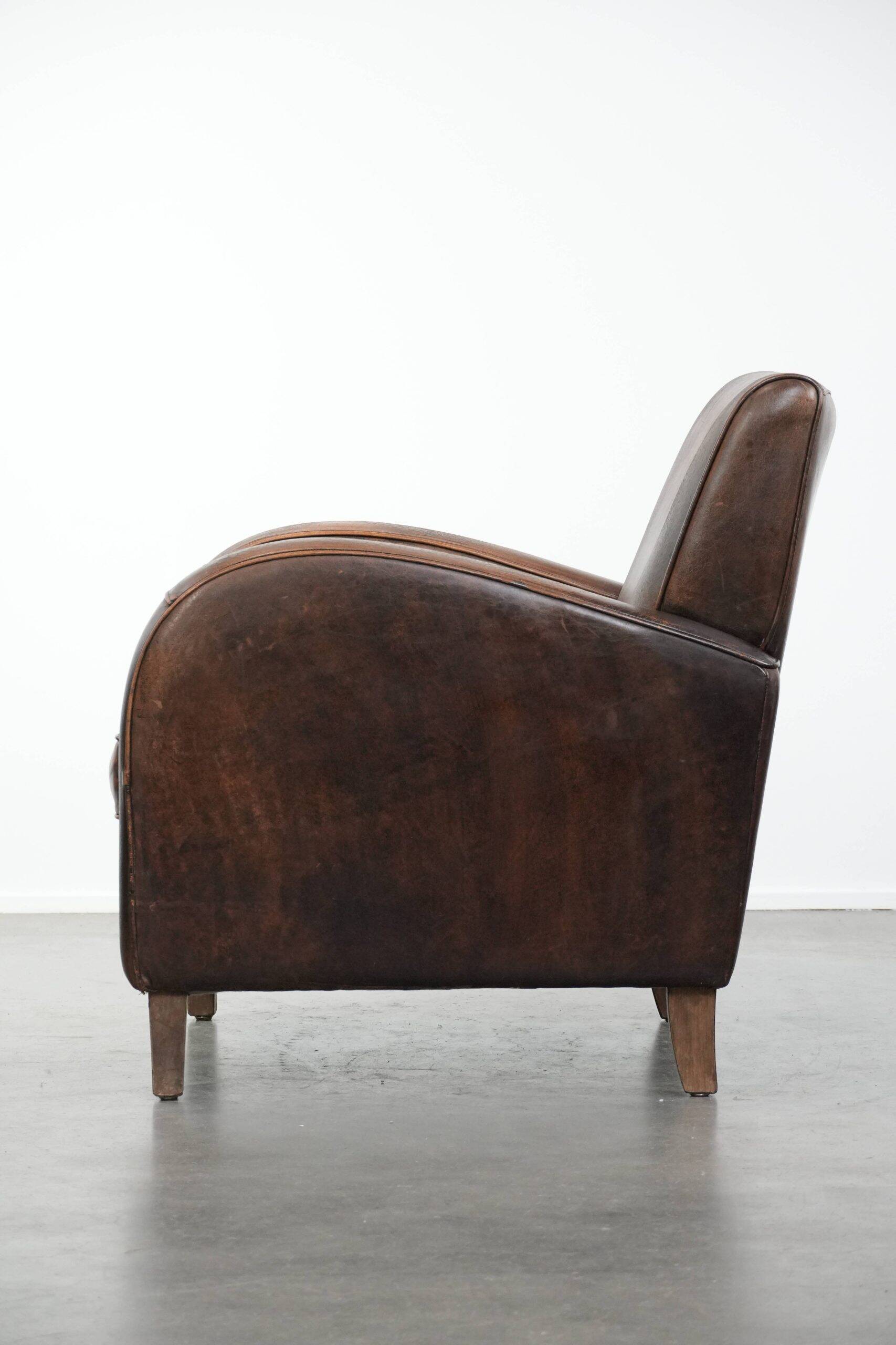 Vintage sheepskin leather design armchair in a dark cognac colour