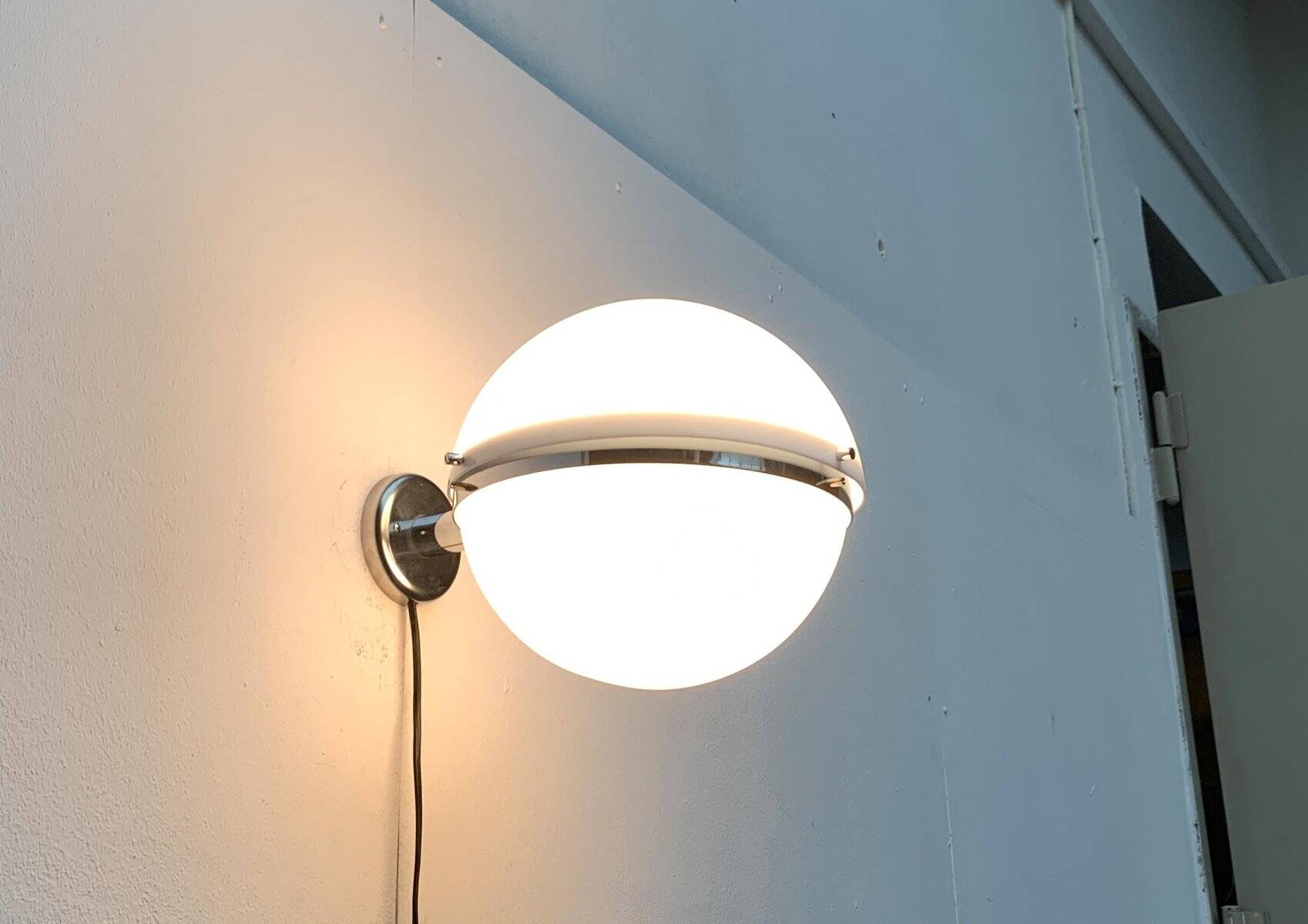 Mid-century Italian space age spherical wall light by Guzzini.