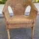 Rattan and woven wicker armchair in vintage bohemian style