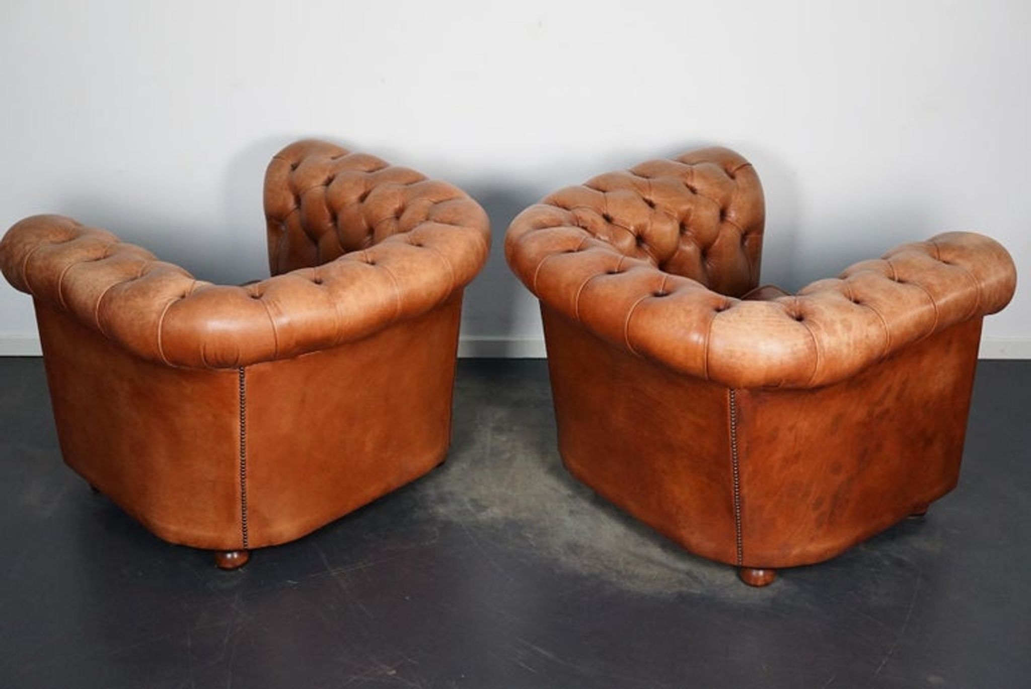 Set of 2 vintage chesterfield club armchairs in cognac leather, Netherlands,