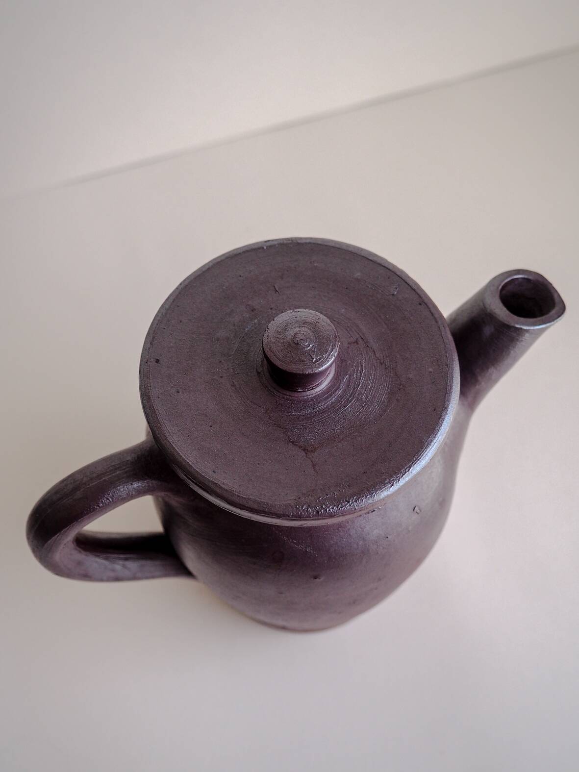 Brown ceramic artisan coffee maker