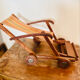 Vintage wooden folding doll's deckchair on wheels