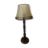 Large vintage wooden floor lamp with parchment shade and pendants.