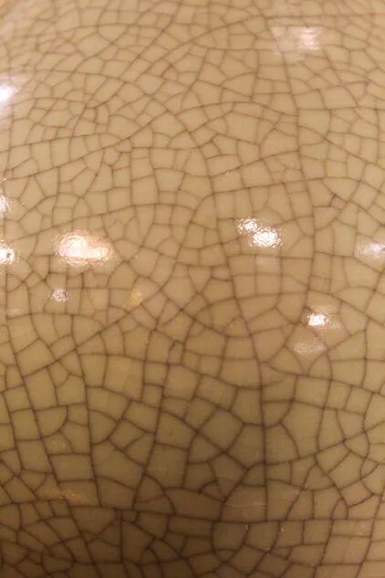 Ceramic lamp with a crackled celadon green finish.