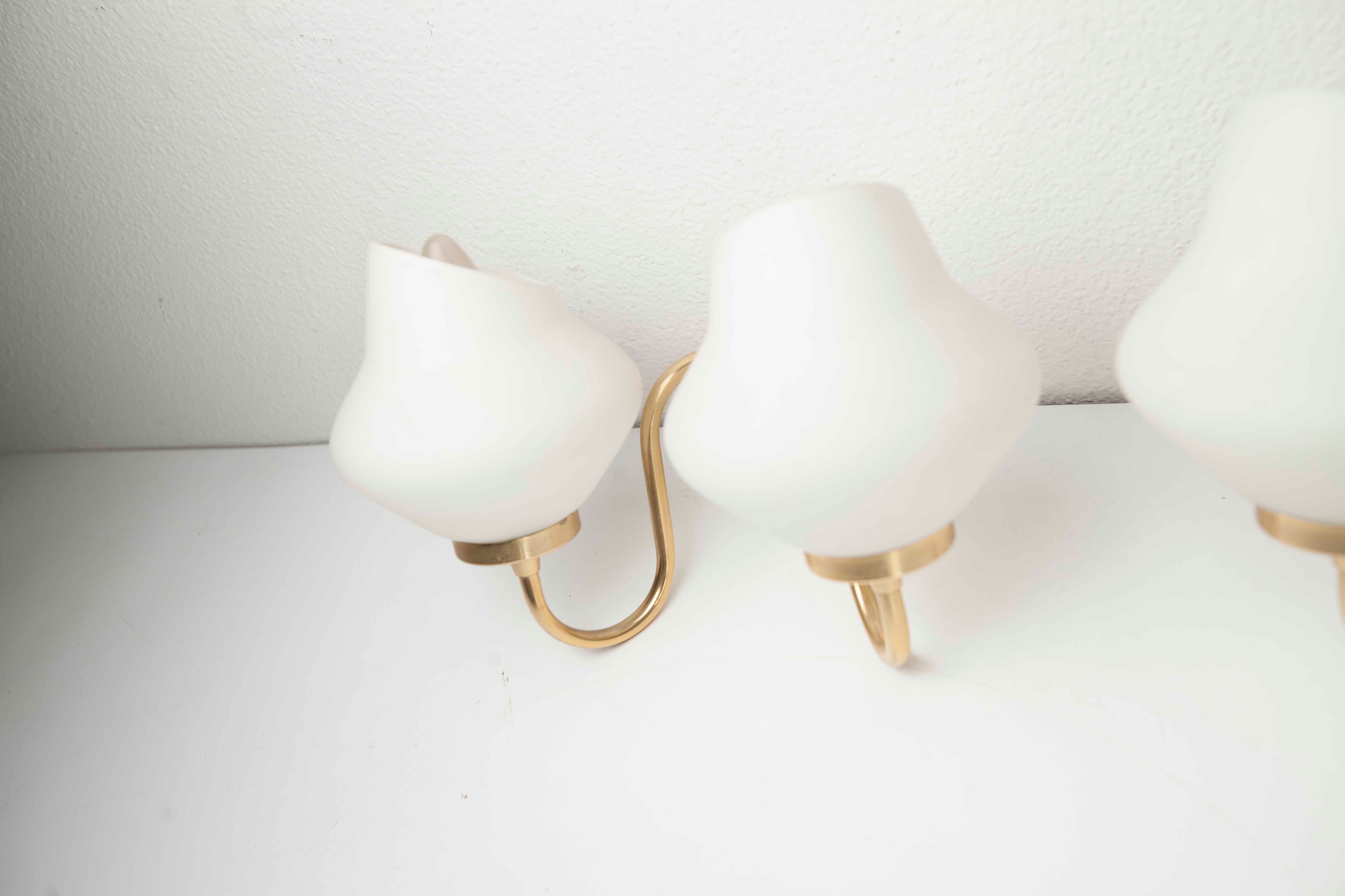 Pair of 60s brass and opaline sconces