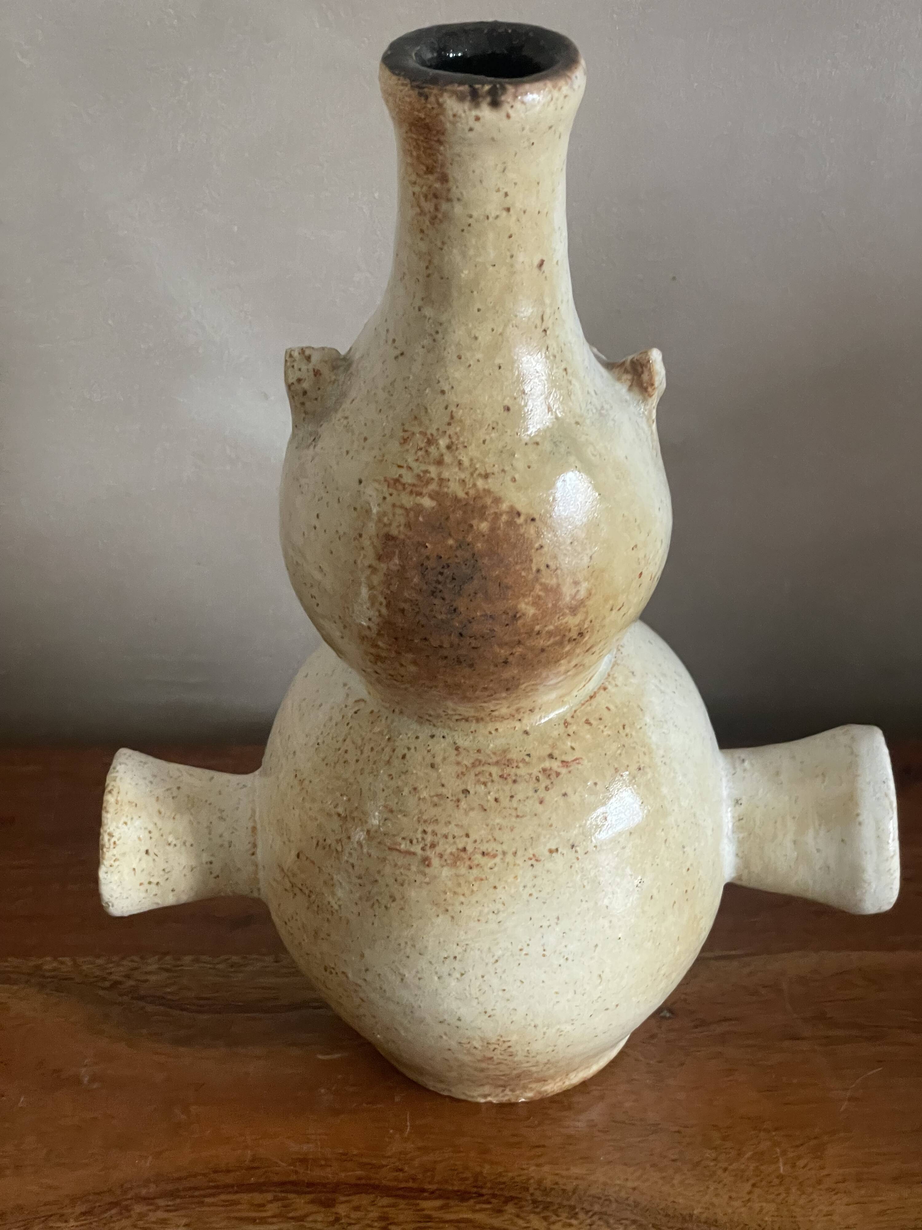 Zoomorphic owl base in sandstone