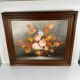 Vintage decorative table featuring a floral still life, signed Frederik.