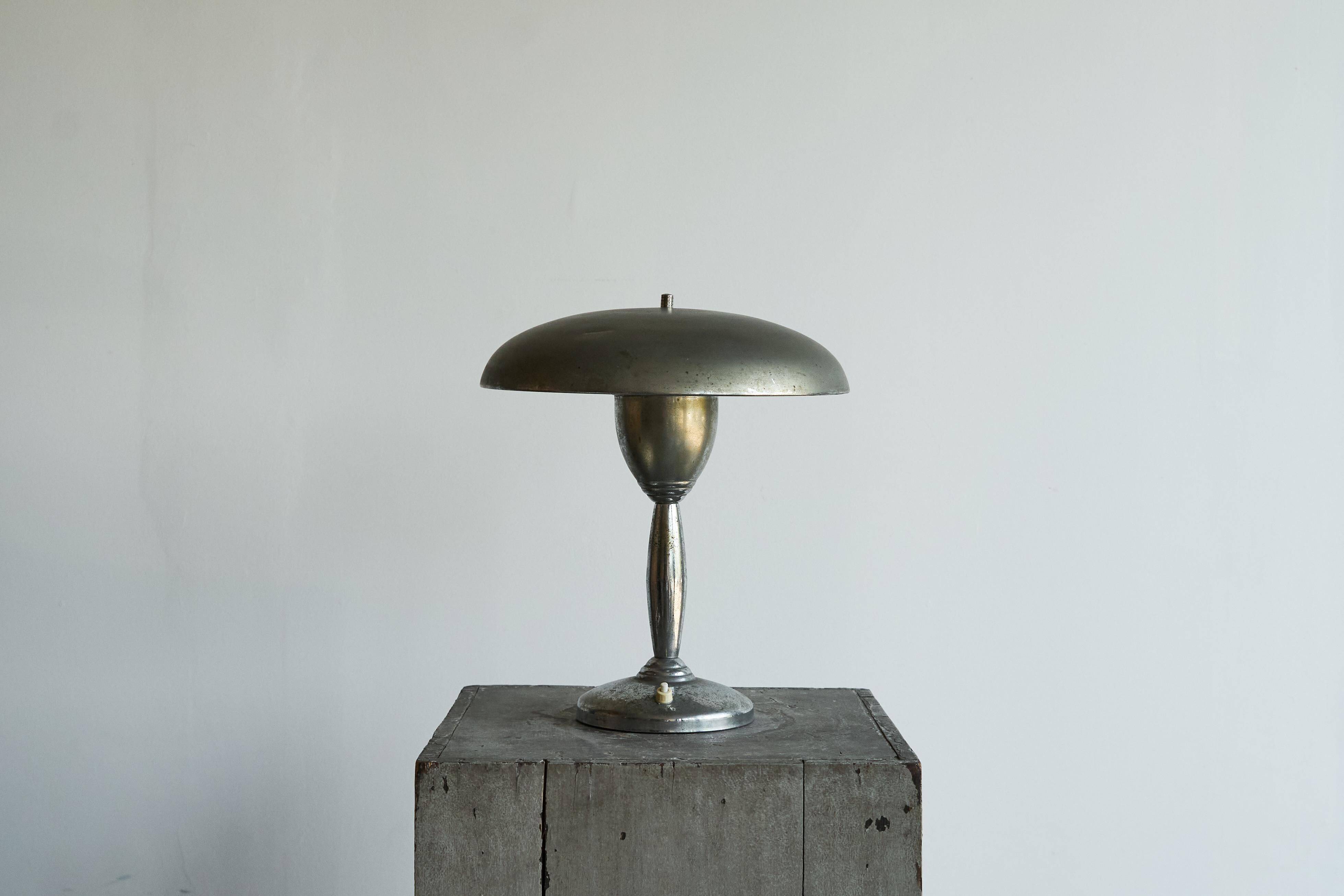 Patinated brass and chrome table lamp from the 1950s.
