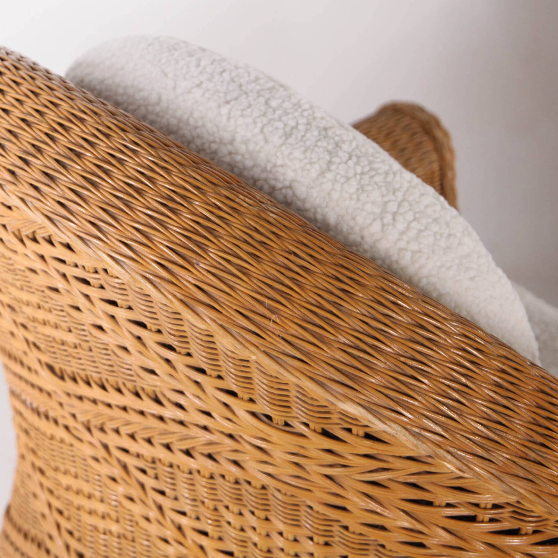 Pair of woven wicker armchairs