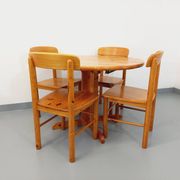 Suite of a round table with extension and 4 vintage pine chairs from the 60s and 70s