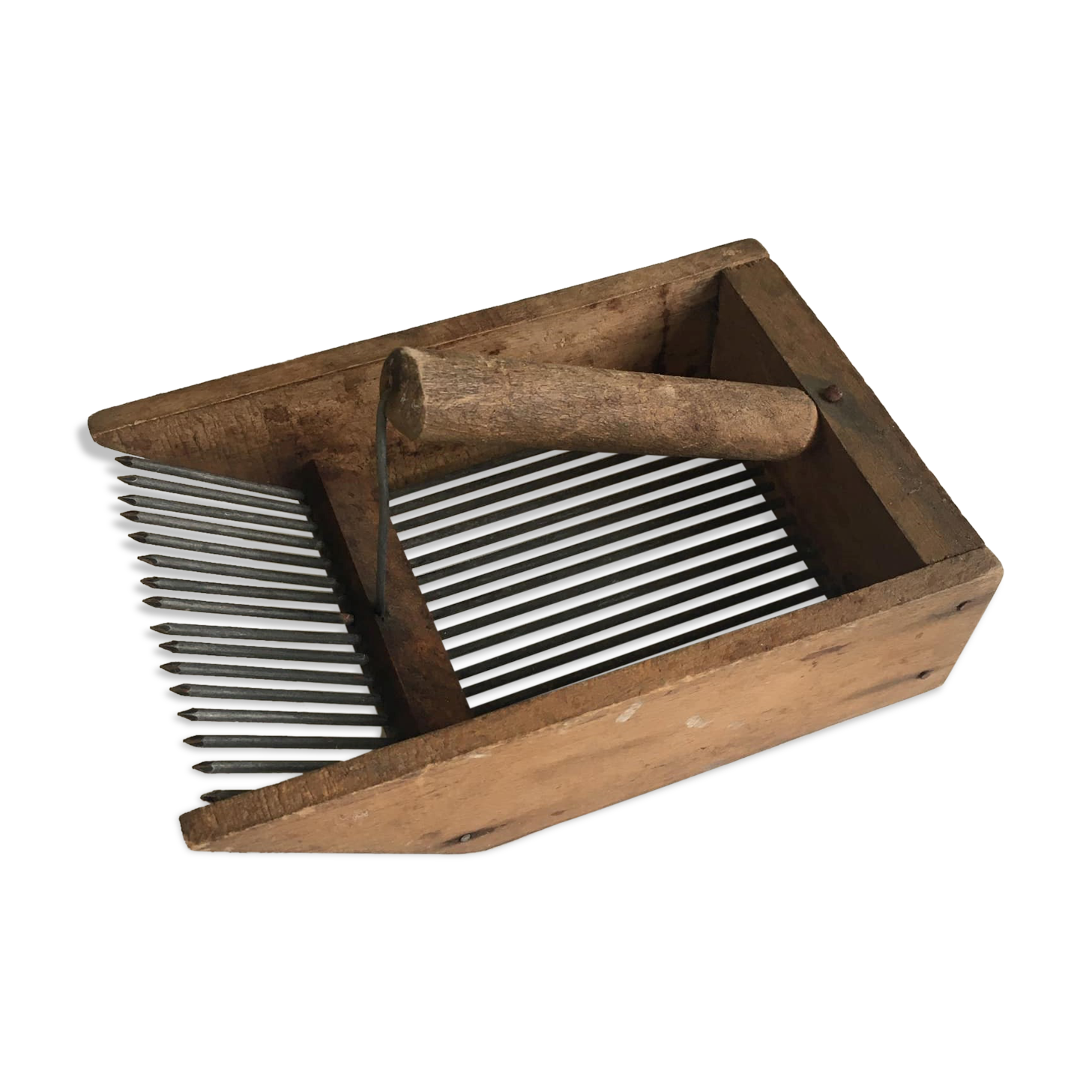 Old comb with berries (blueberries ..) in wood and metal