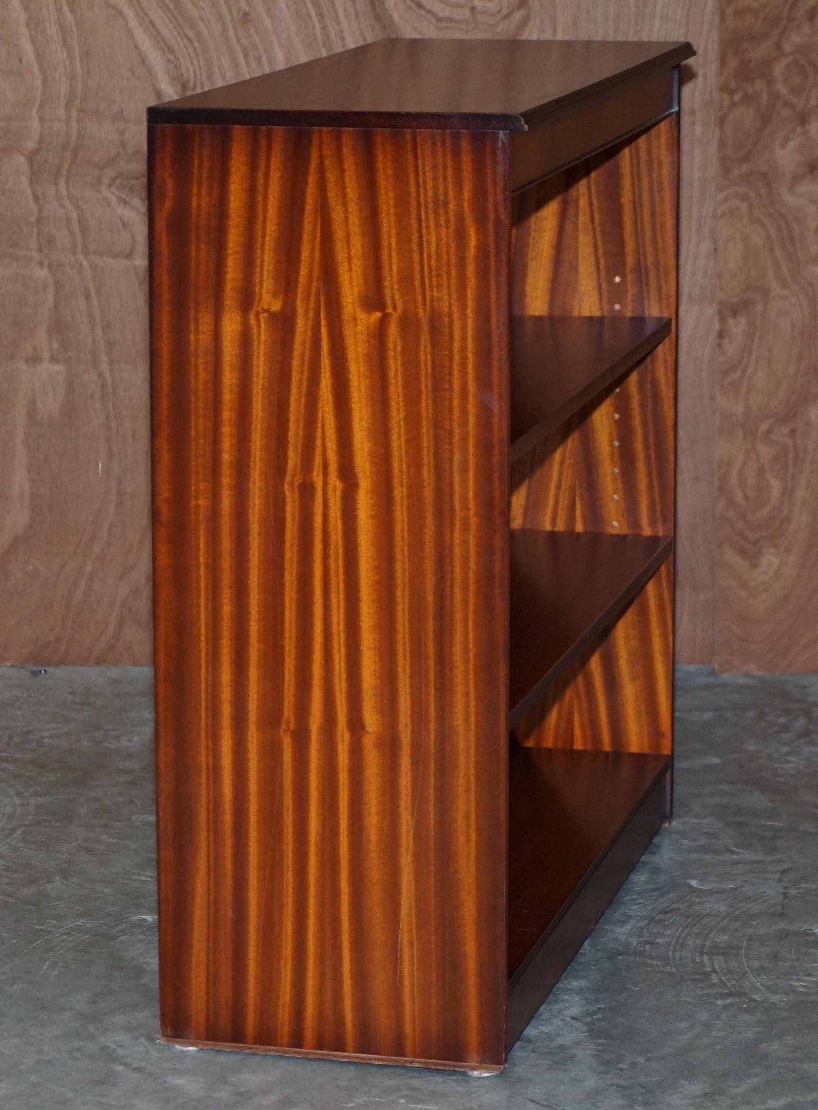 Pair of open low bookshelves Shaws of London in hardwood.