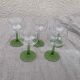 5 transparent glass glasses and green glass vase go
