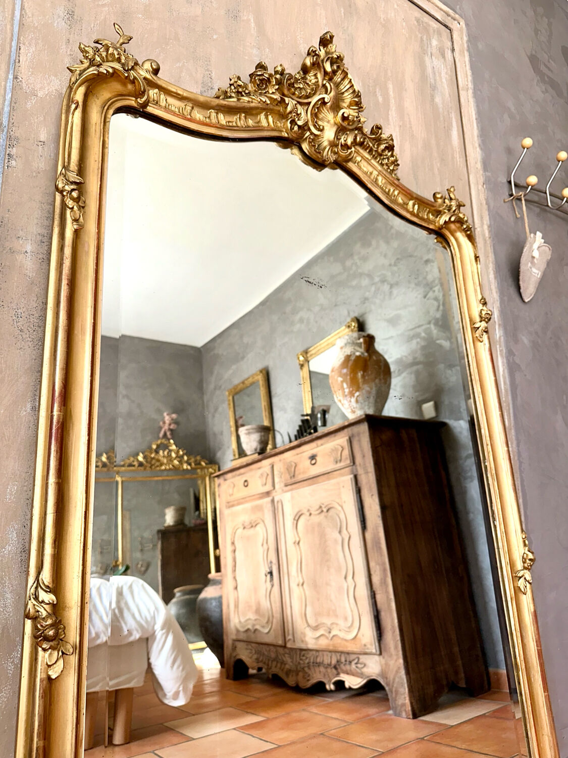 Antique gilded mirror with Louis XV pediment