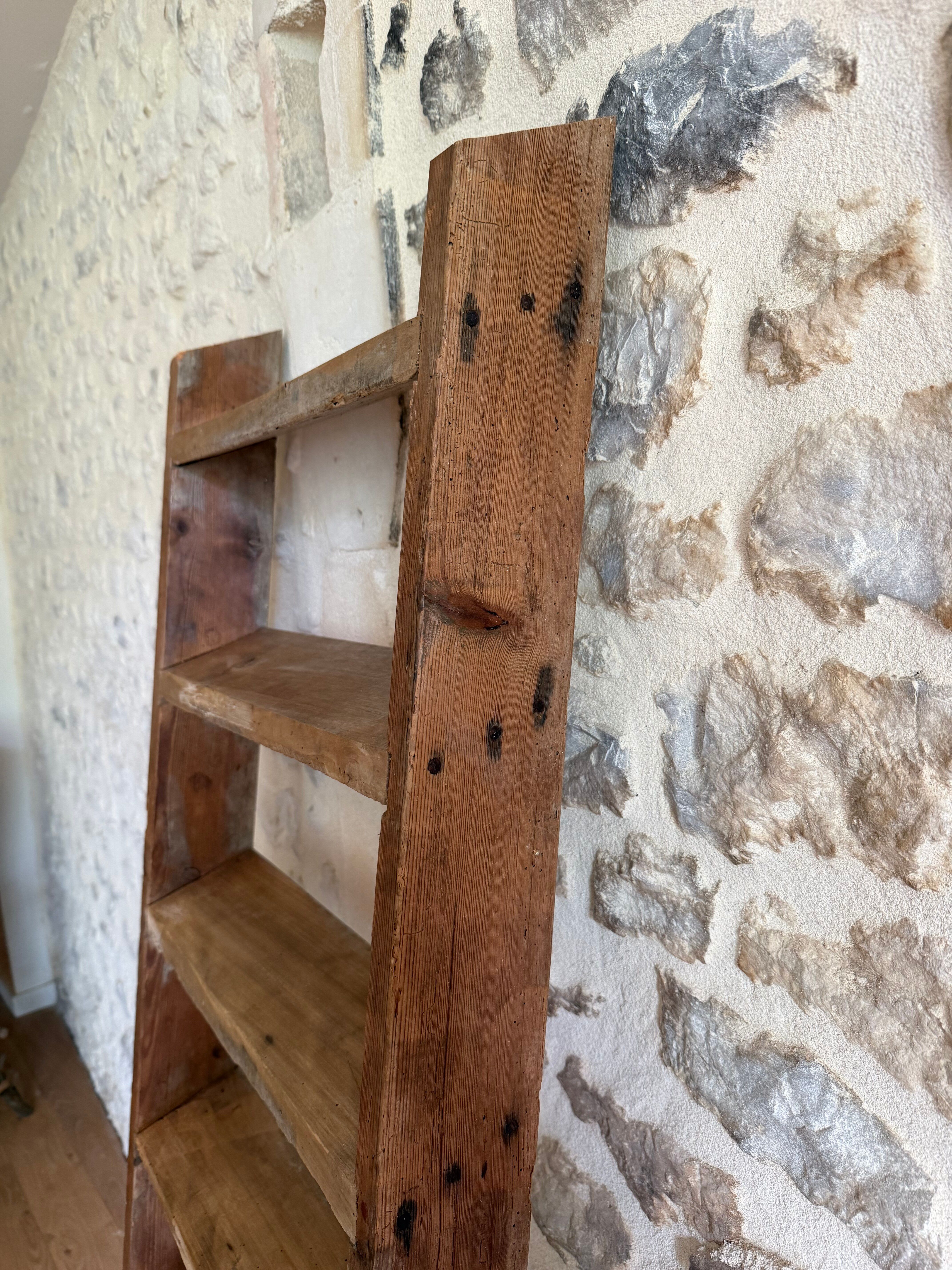 Decorative wooden ladder or towel rack.