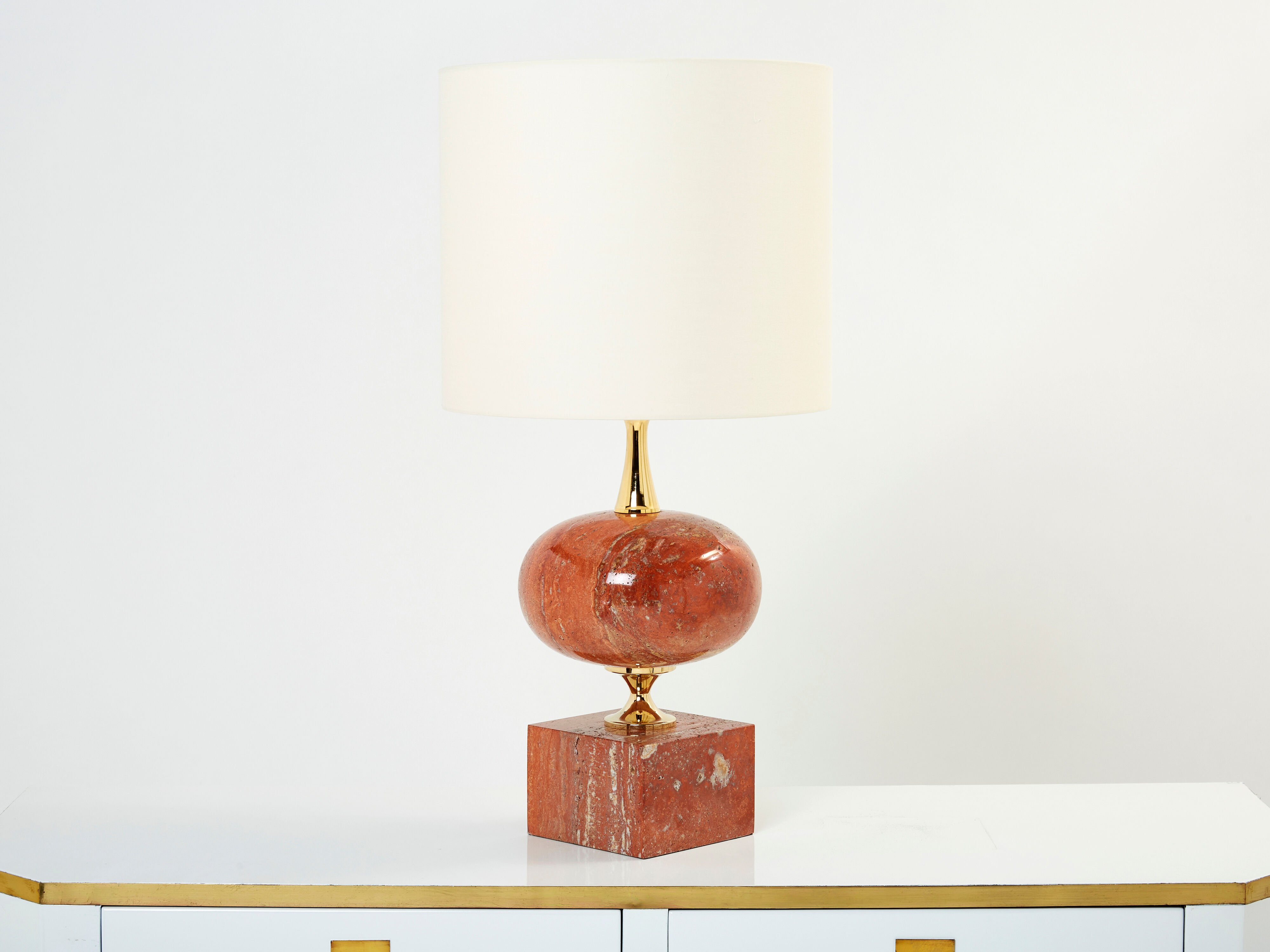 Pair of lamps in red travertine and brass 1970