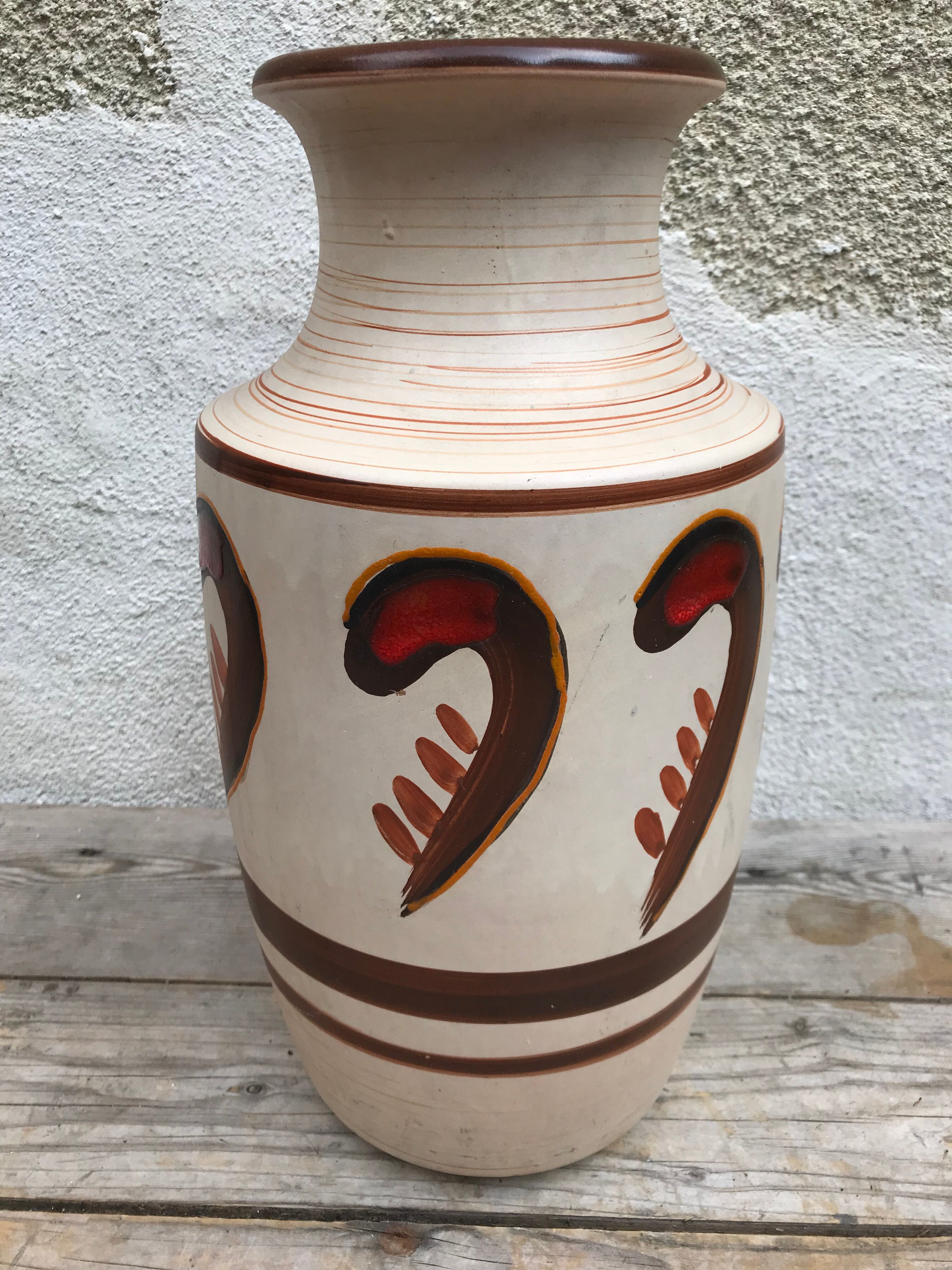 Antique beige ceramic vase with decorative painting