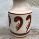 Antique beige ceramic vase with decorative painting