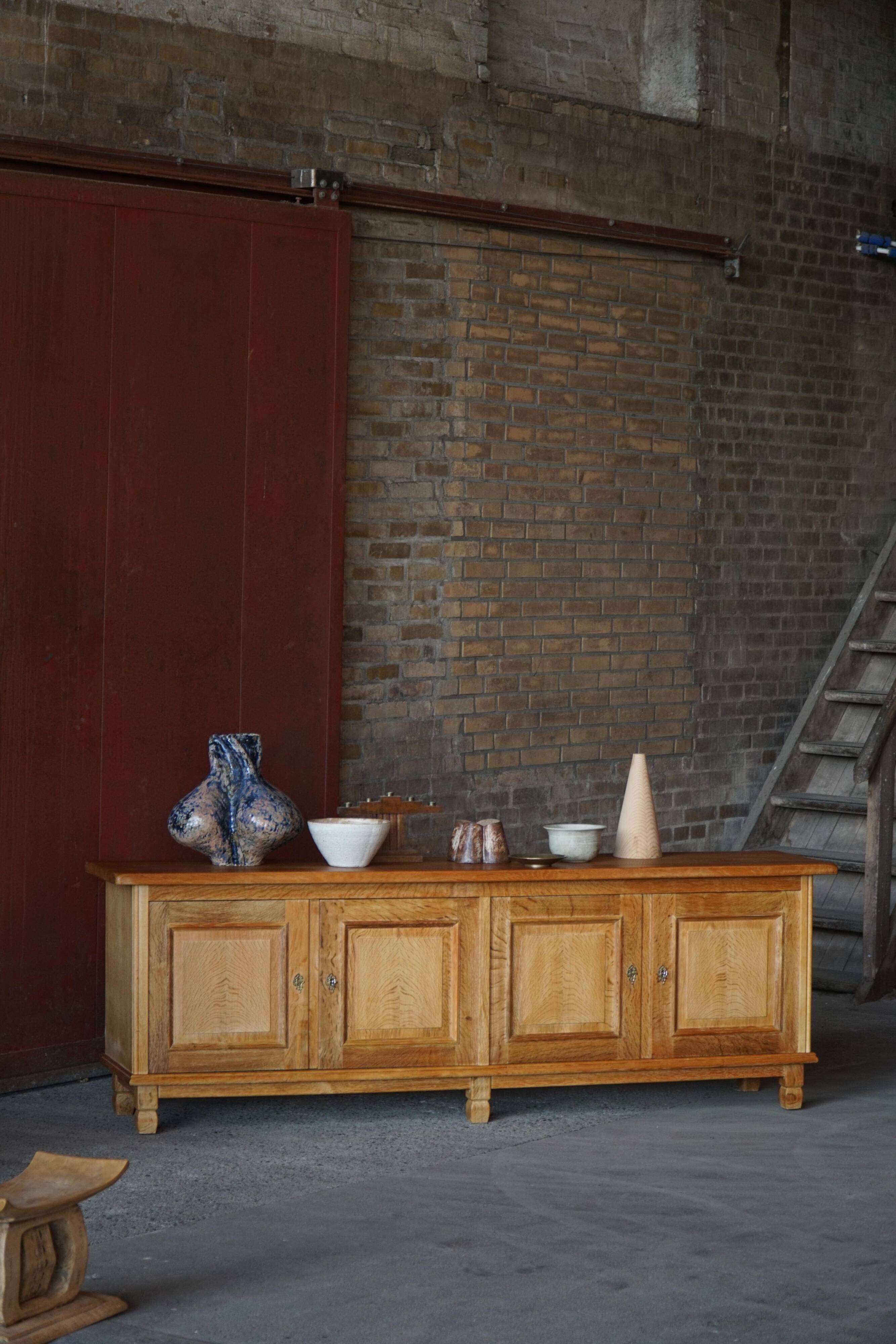 Modern Danish low enfilade in oak with panelled doors, mid-20th century.