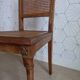Art Deco caned chair with bronze ornaments.