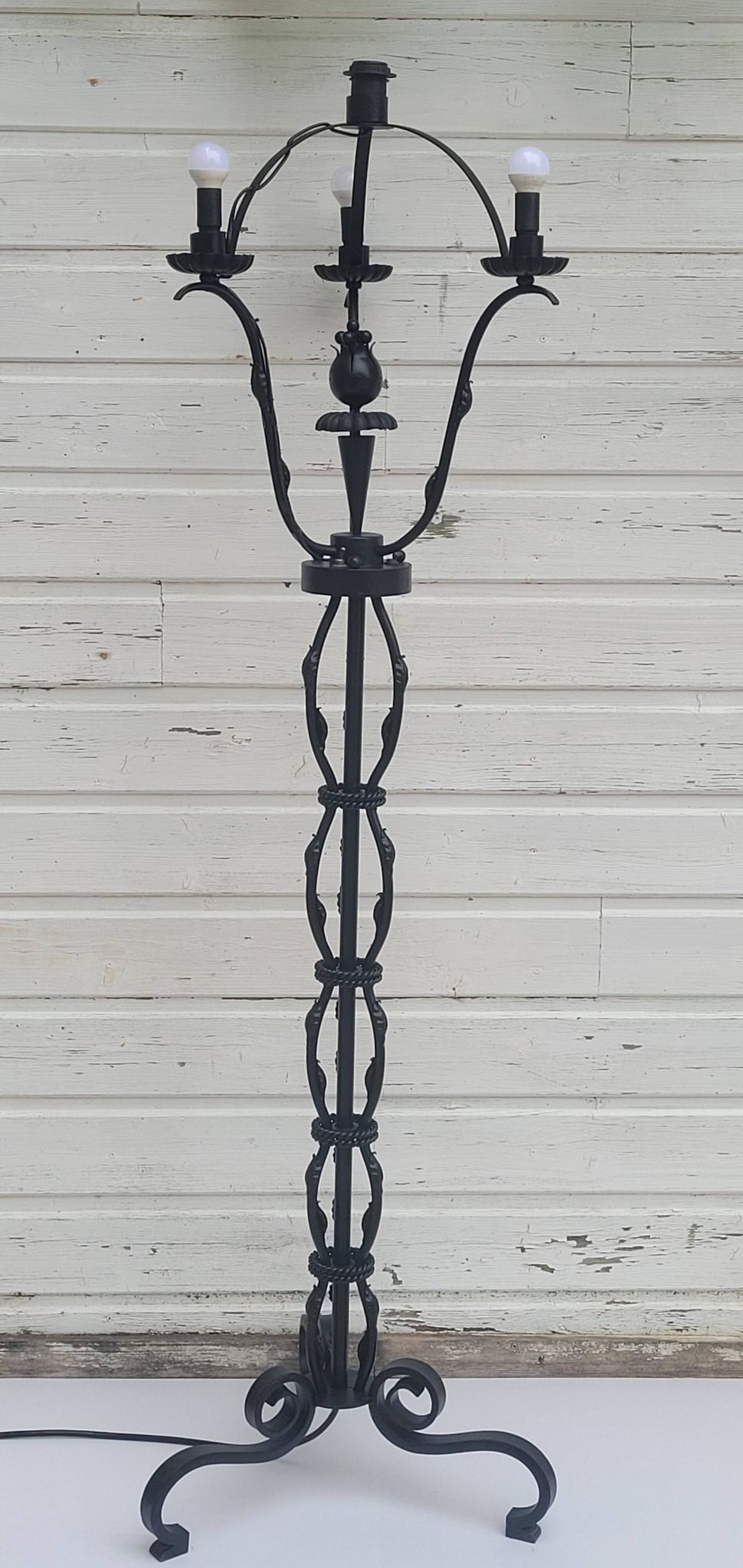 Black wrought iron floor lamp attributed to Gilbert Poillerat