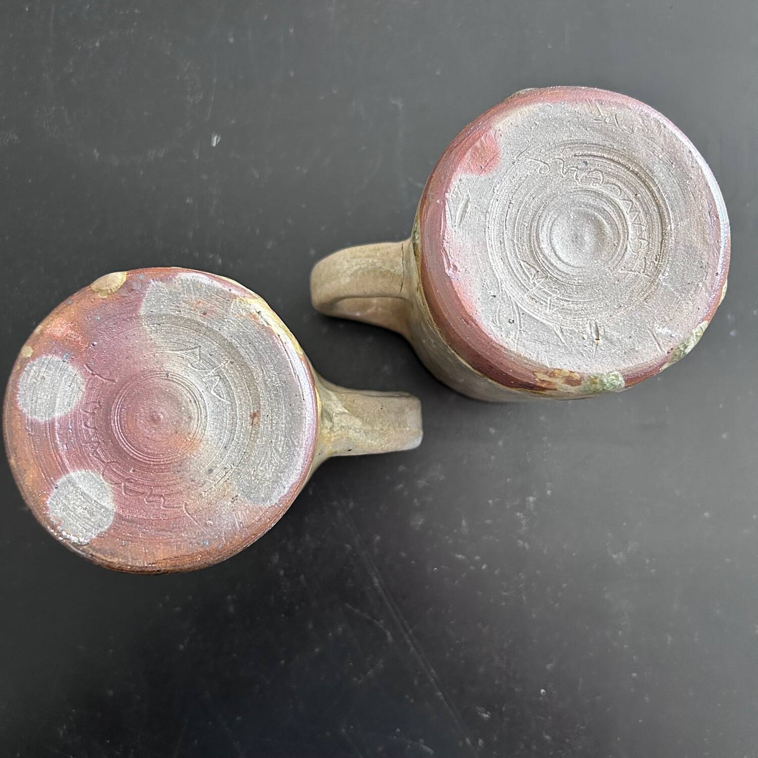 Pair of signed stoneware mugs