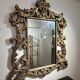 Gold wooden wall mirror with floral decoration