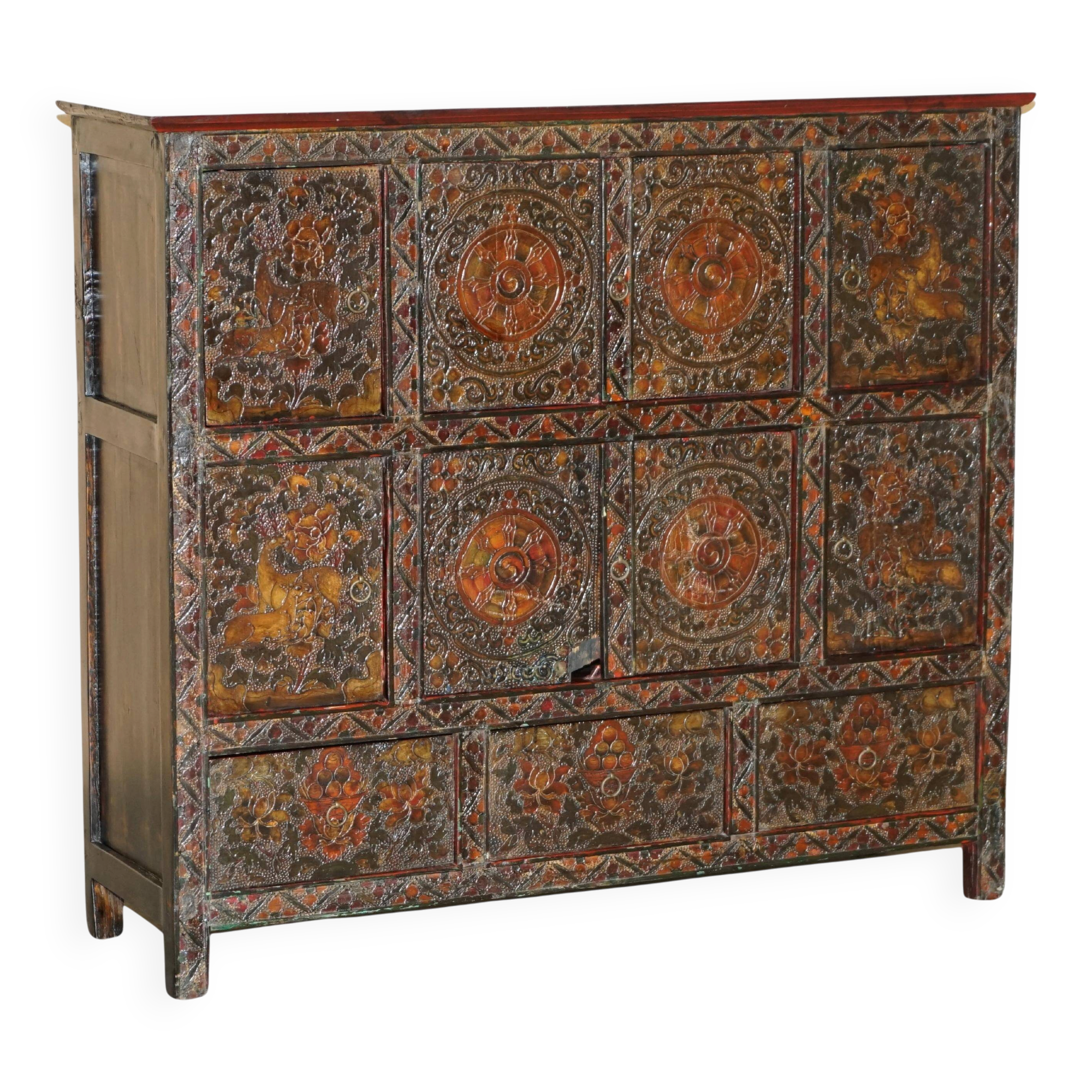 Antique polychrome Tibetan altar cabinet with deer and flowers.