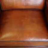 Set of 2 very comfortable large sheepskin armchairs elegantly finished with black piping