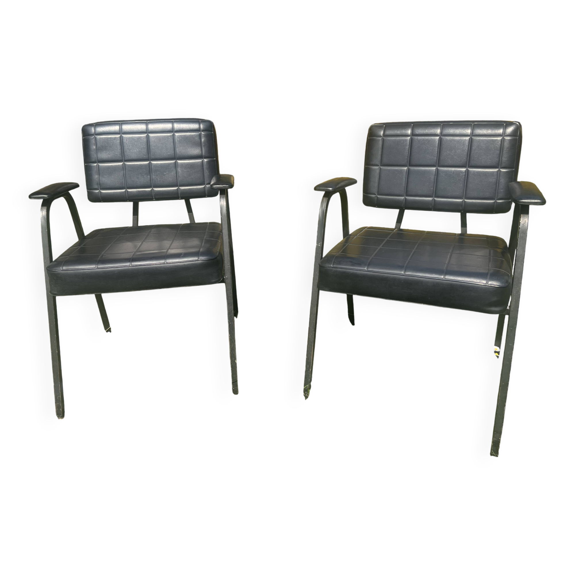 Pair of vintage industrial armchairs in black imitation leather and metal legs