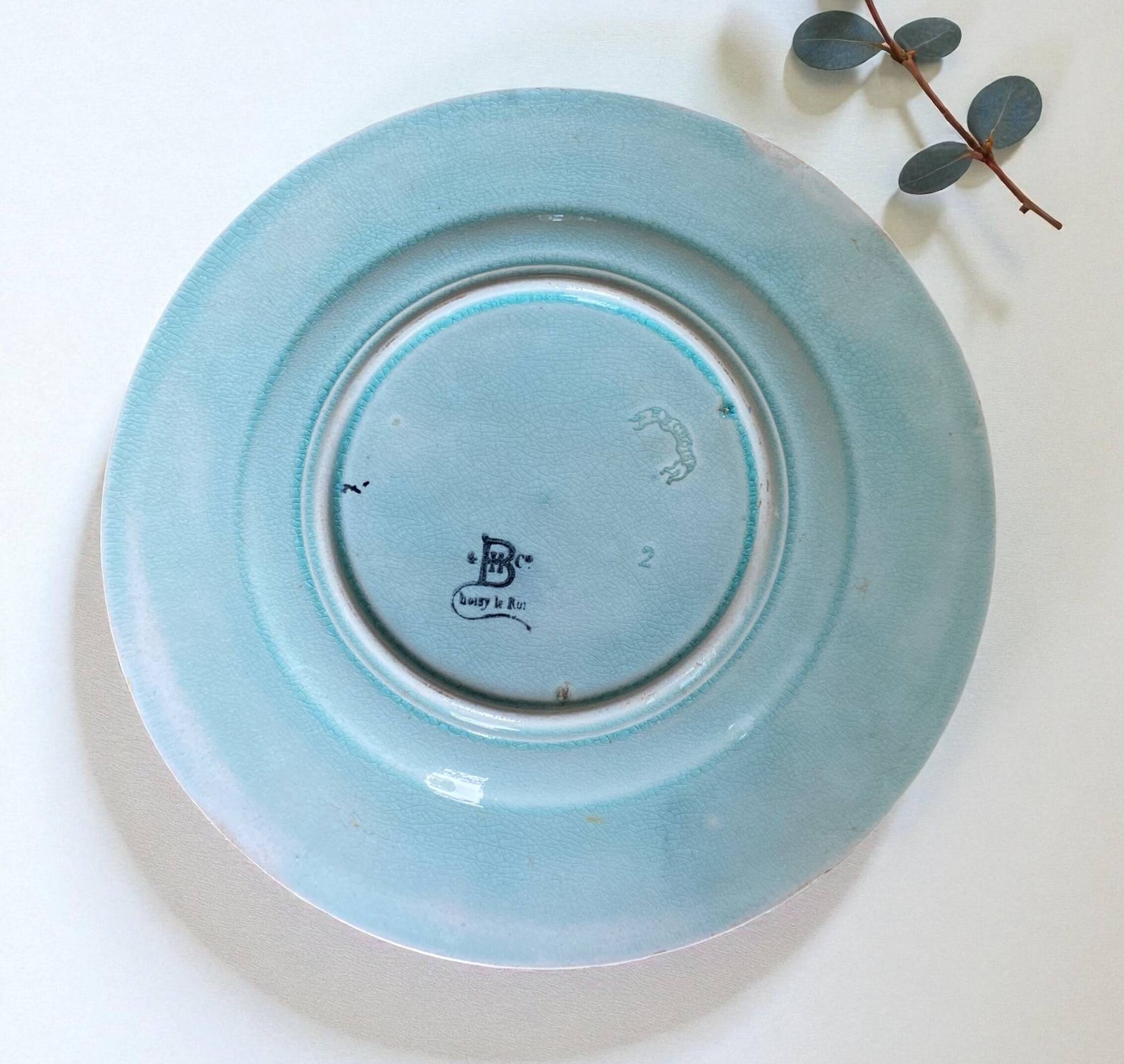 Antique plate from the Choisy Le Roi collection in slip with foliage and flowers
