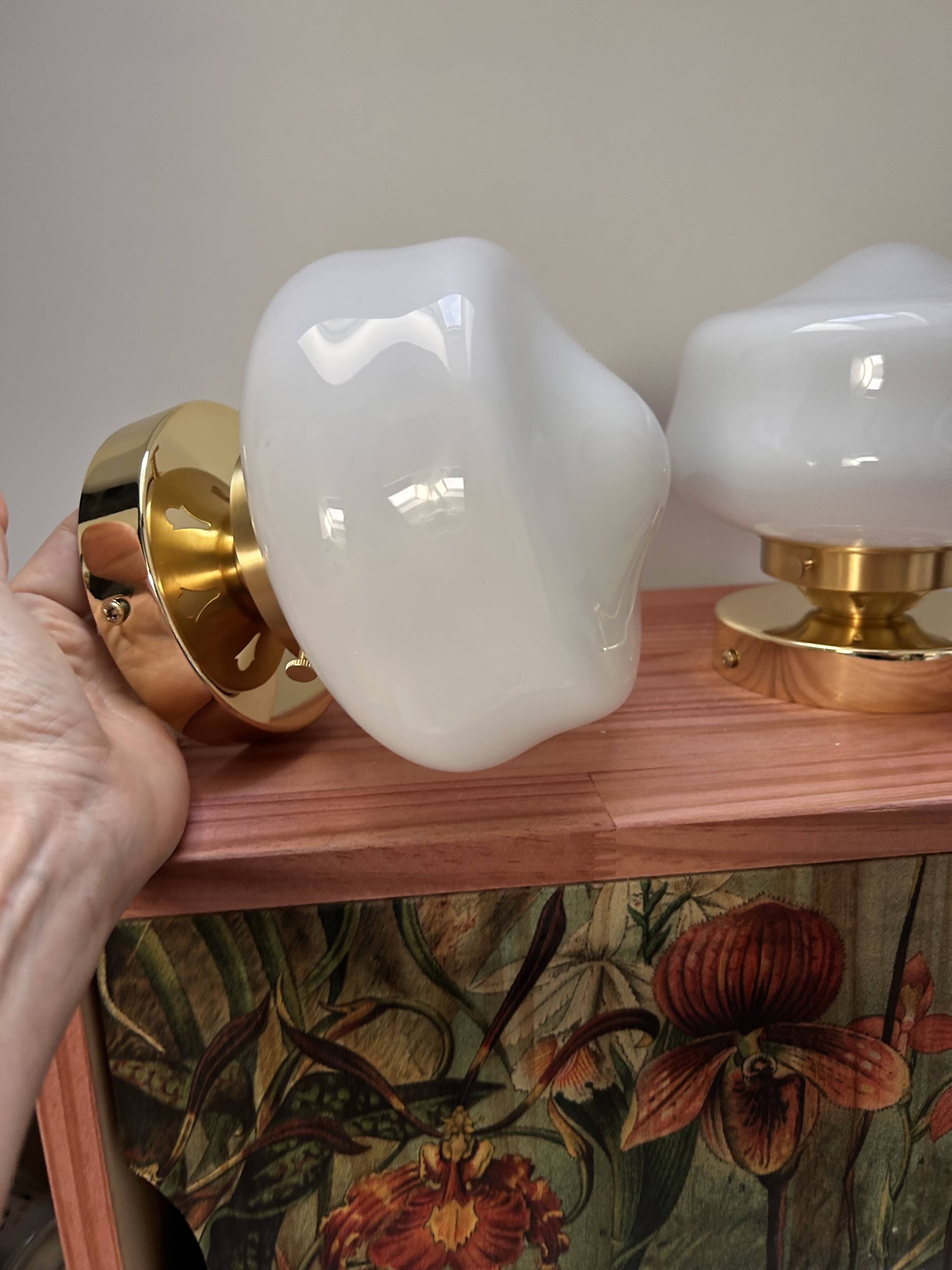Pair of white opaline globe wall lights