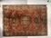 Antique wool rugs with designs on a red background, 20th century.