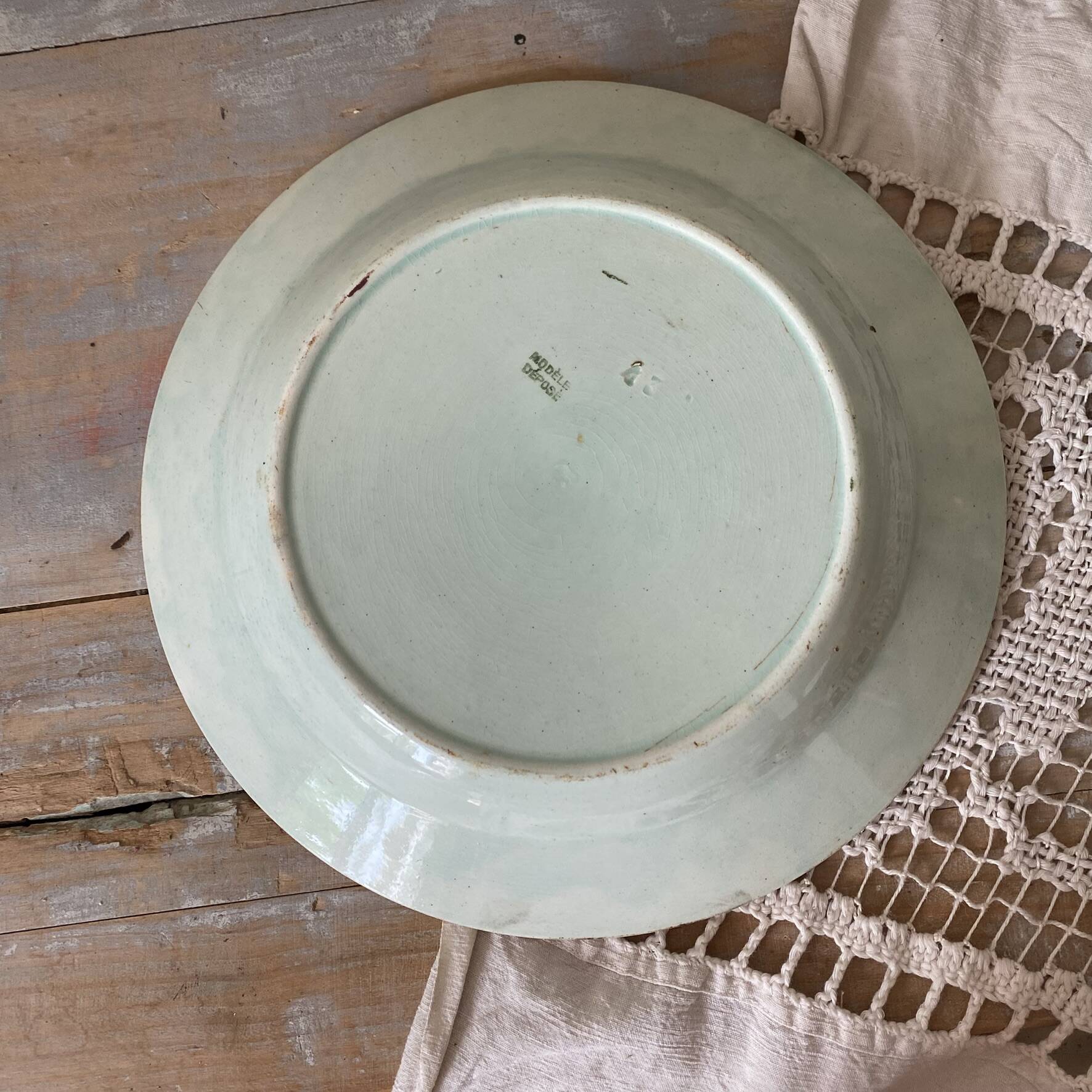 Antique shallow dish in slipware with pear decoration.