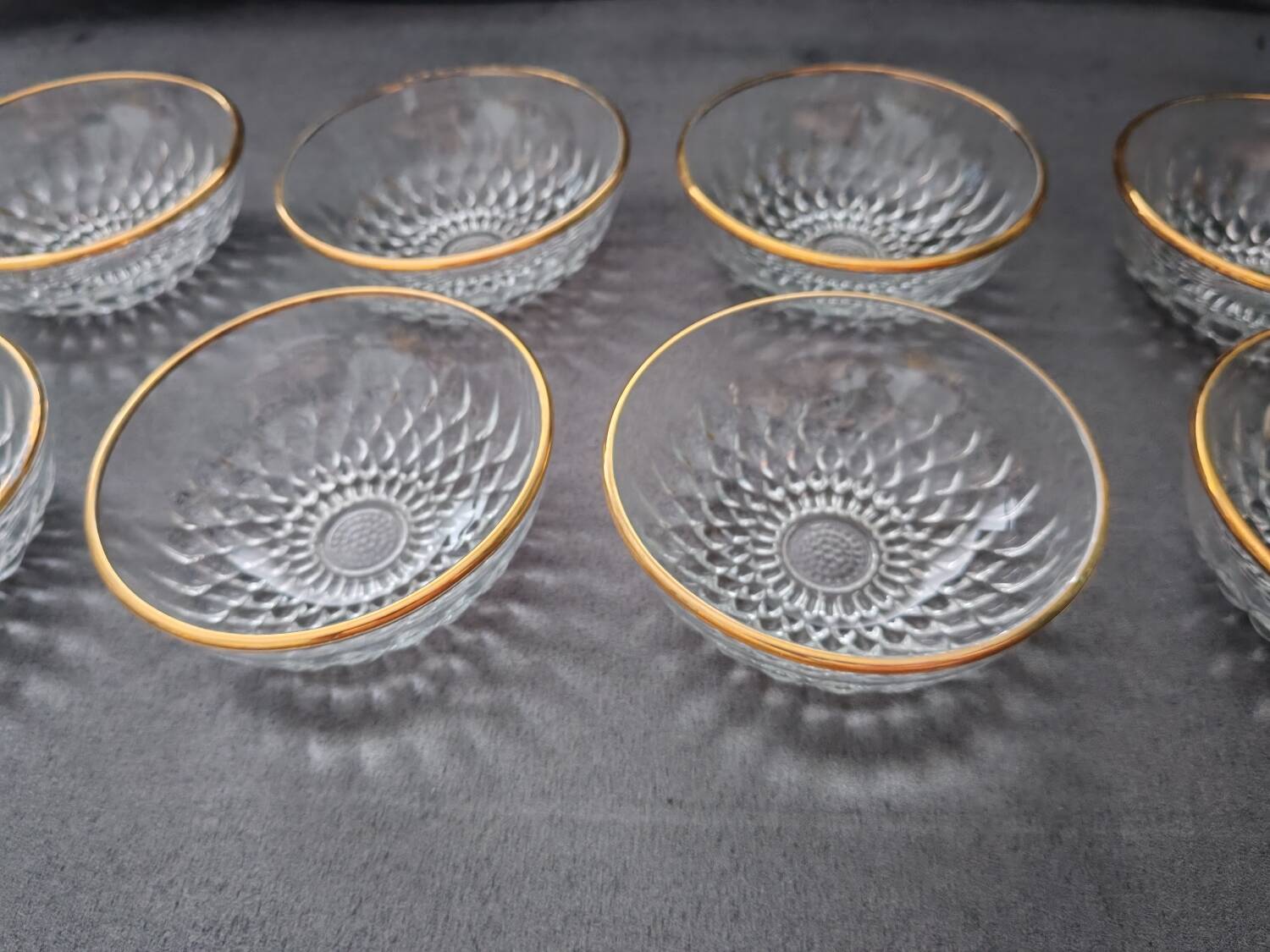 8 glass bowls with gold rim