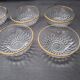 8 glass bowls with gold rim