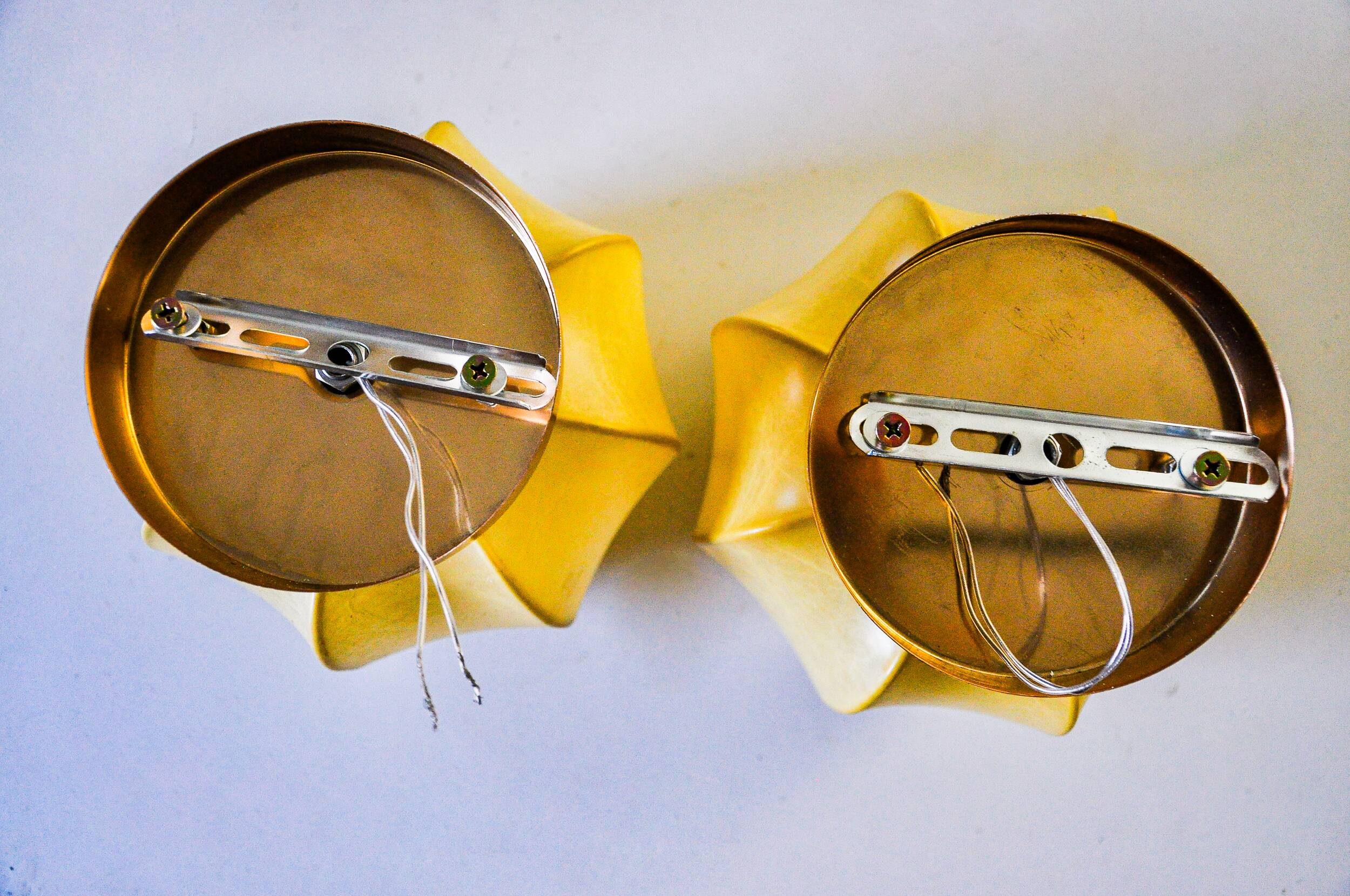 Pair of circular "cocoon" wall lights, resin and pine, Italy, 1970