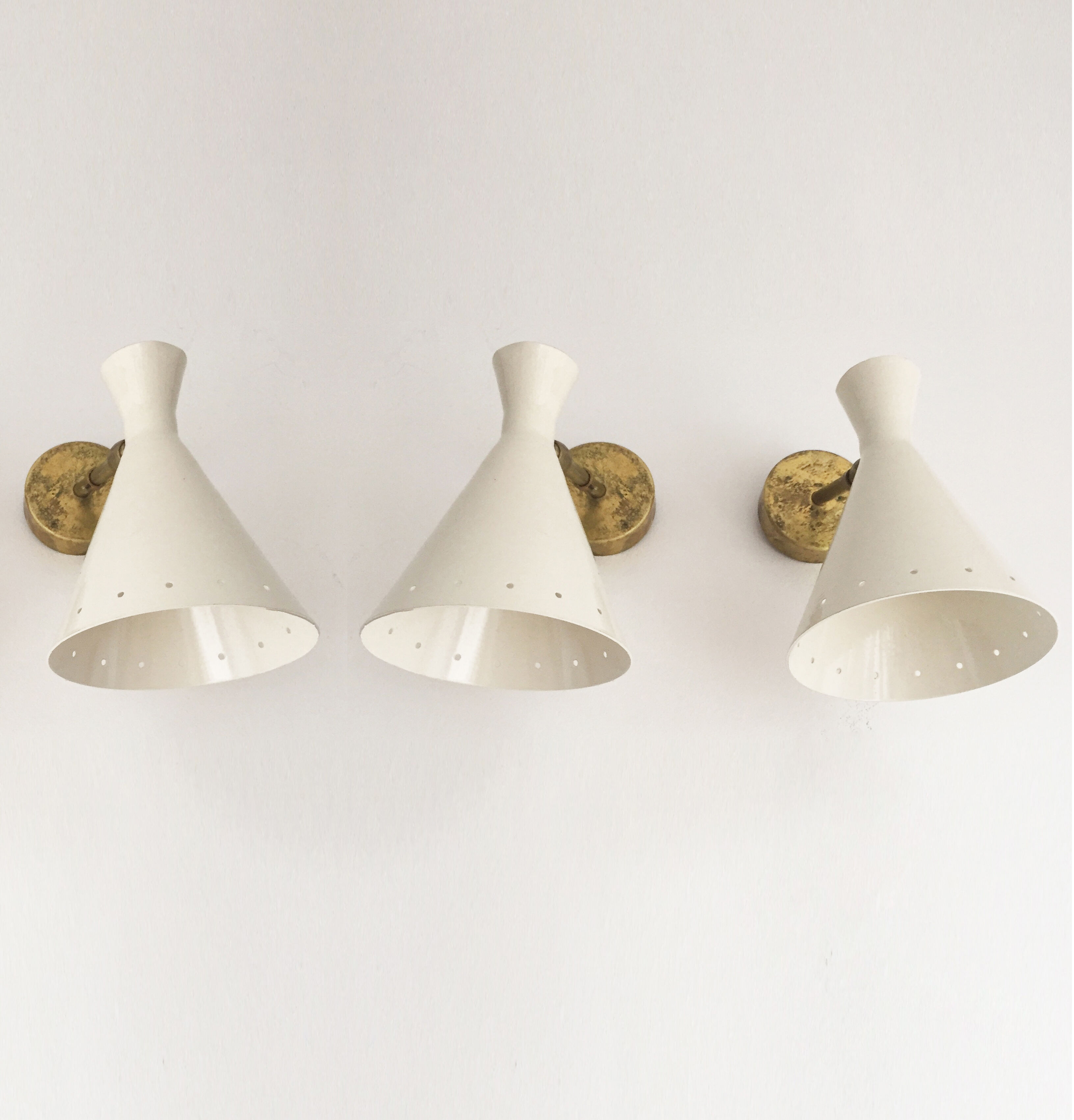 Suite of three Italian wall lights 1950