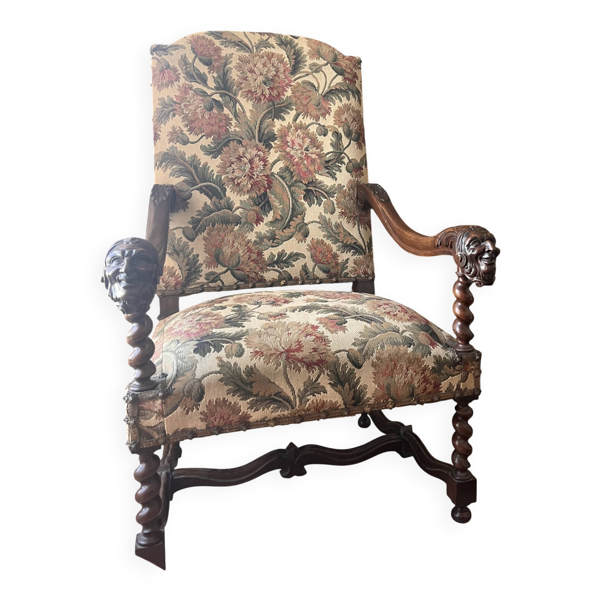 Antique armchair in Henri II style with masks